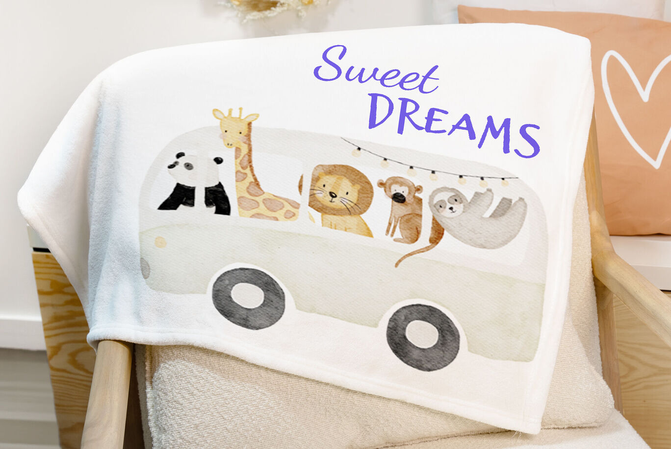 Manta infantil con un lindo diseño de animales y el texto "Sweet Dreams".