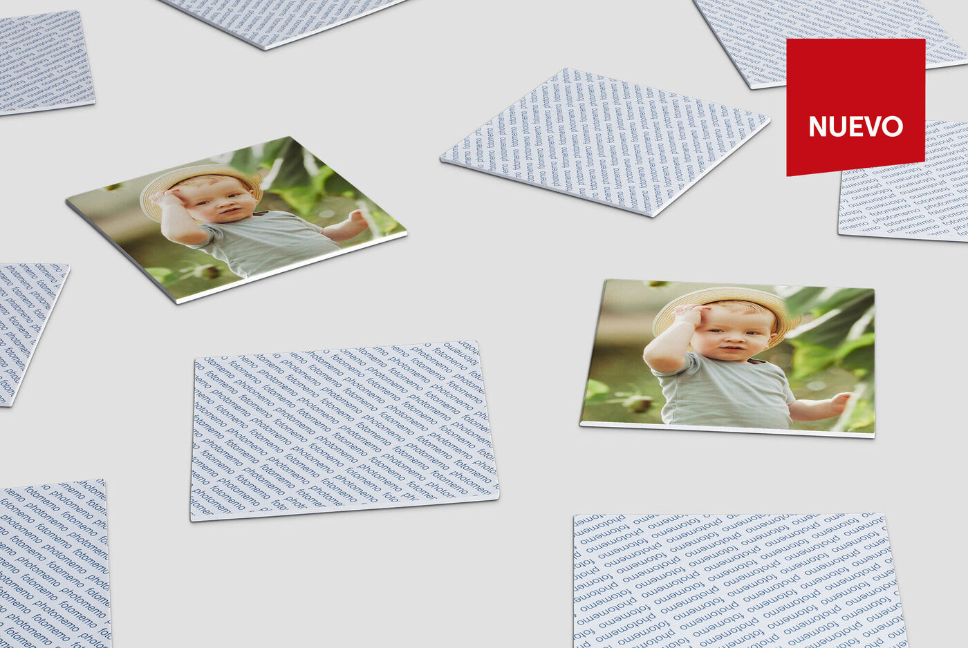 Motivo entretenido con varias tarjetas que muestran fotos de un bebé, sobre un fondo blanco. Una tarjeta resalta con el texto 'NUEVO' en rojo.