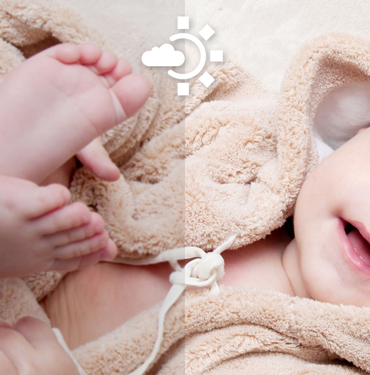 Un bebé sonriente con una toalla beige. Su cabeza y un pie son visibles, fondo suave y claro.