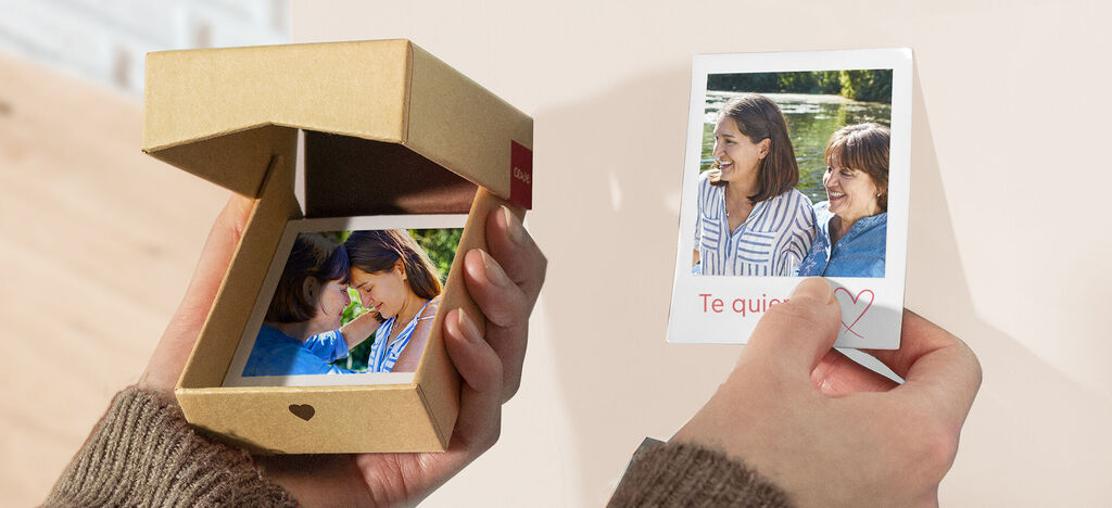 Una caja de regalo práctica con una foto dentro, al lado una tarjeta que dice 'Te quiero' con un corazón