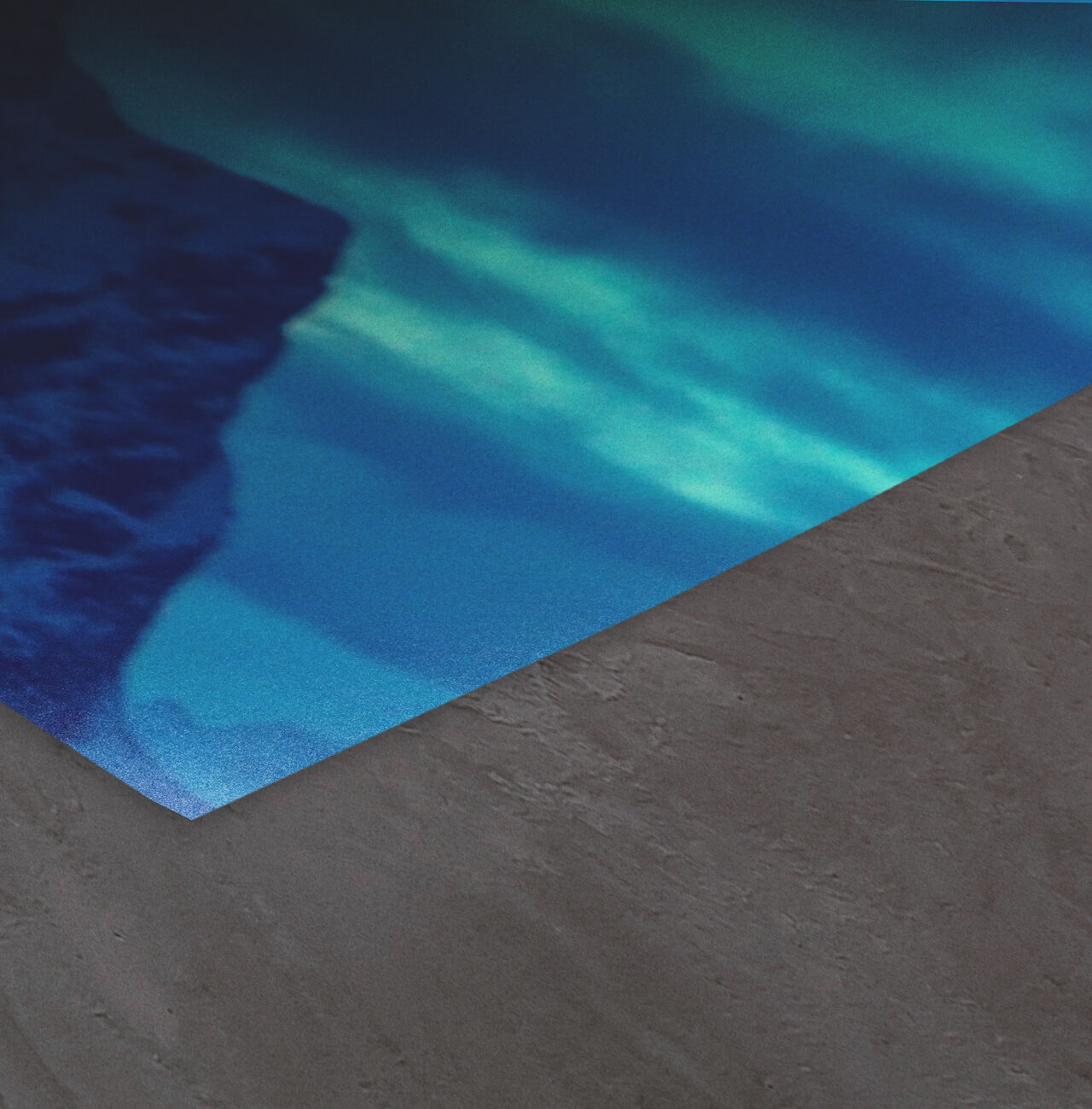 Primer plano de una superficie mate con suaves tonos azules y verdes.
