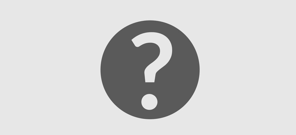 Círculo gris con un gran signo de interrogación en el centro, simboliza curiosidad y preguntas.