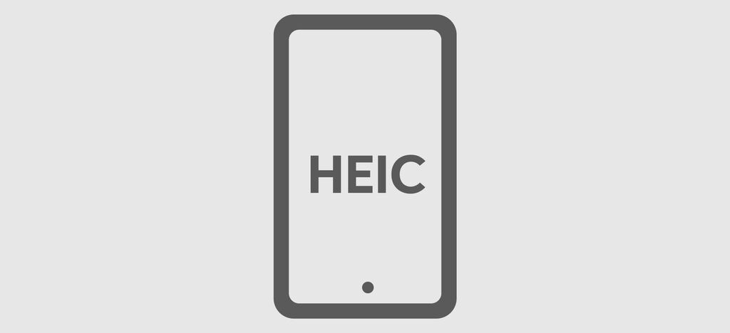 Un smartphone gris con el texto HEIC en la pantalla. Muestra un dispositivo para tomar o ver imágenes.