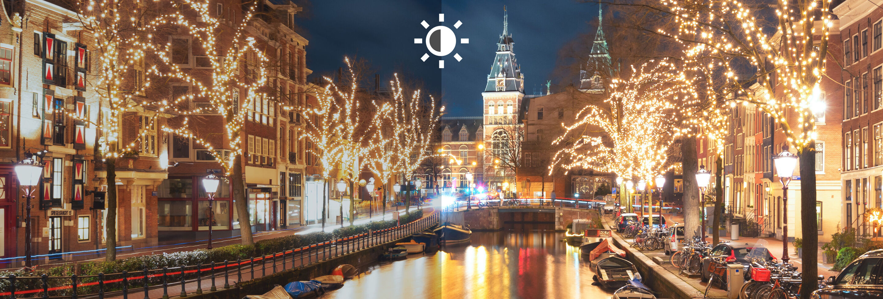 Árboles iluminados en el canal de Ámsterdam de noche.