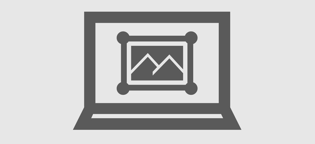 Un laptop con una ventana abierta mostrando una imagen de montañas